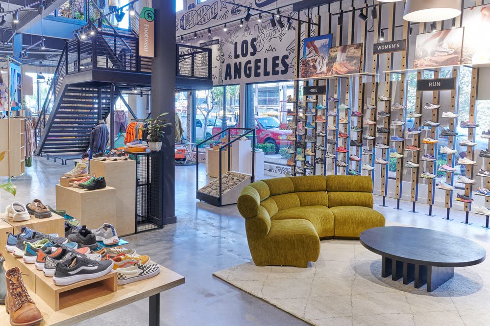 Backcountry store interior — footwear wall and mural