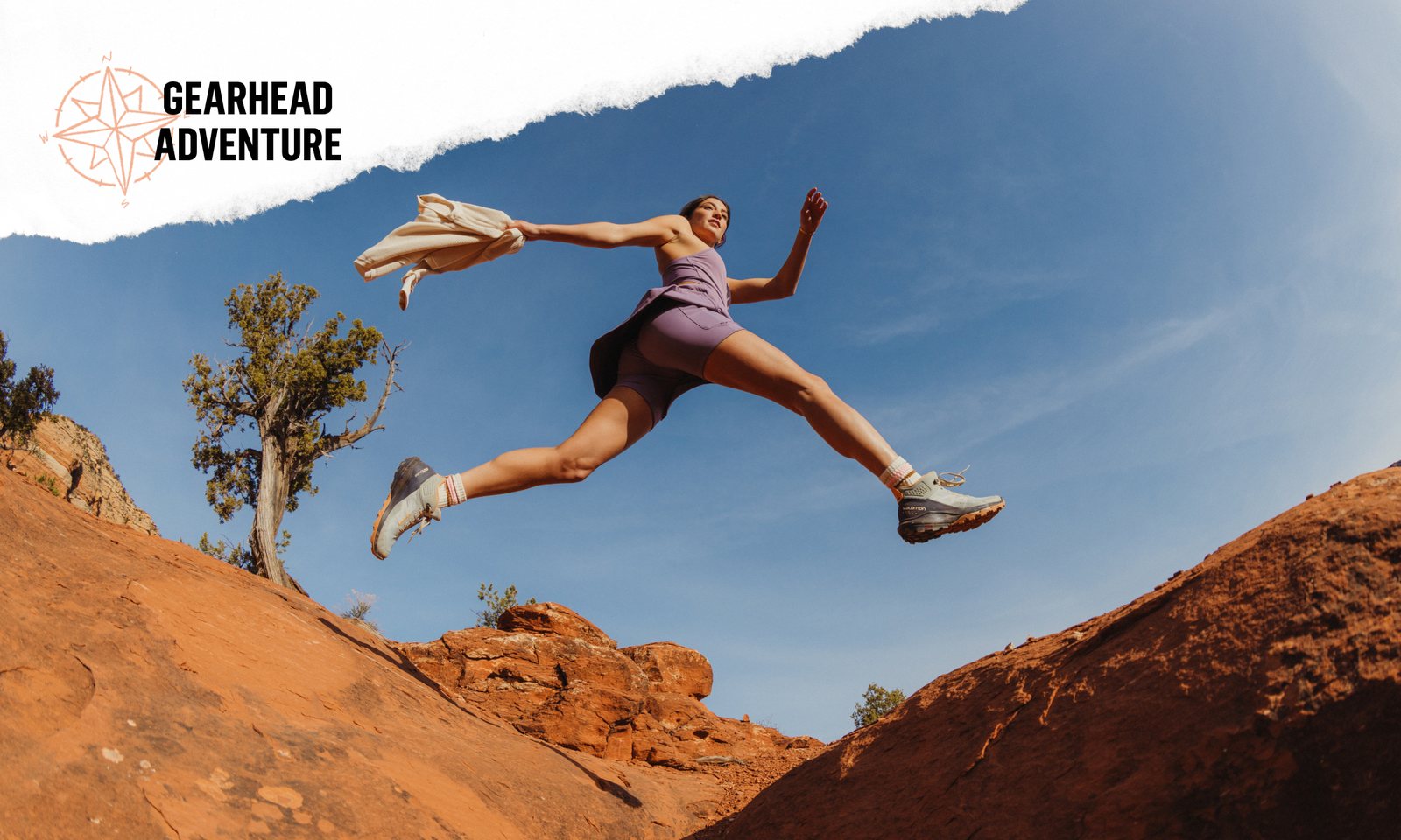 Gearhead Adventure — trail runner leaping between red rocks
