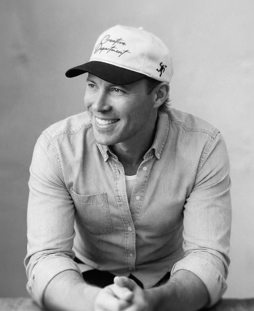 Taylor Buck — portrait in a Creative Department cap